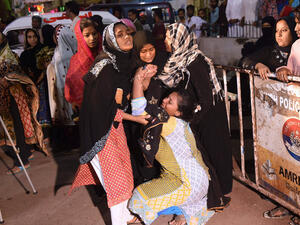 Pakistani women mourn the death of relative outside of a mortuary in Karachi on Saturday, following a suicide bombing at a Sufi shrine. (AFP/File)