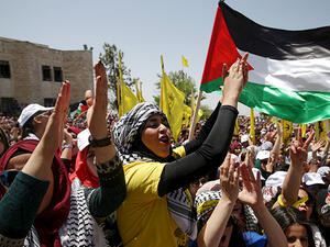 A number of Palestinian activists have criticized the two-state solution as unsustainable and unlikely to bring durable peace, proposing instead a binational state with equal rights for Israelis and Palestinians. (AFP/File)