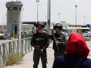 Israeli soldiers stand guard at the Qalandiya checkpoint. (AFP/File)