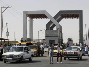 Vehicles drive through the Rafah border crossing point in the southern Gaza Strip on 19 September 2013. (AFP/File)