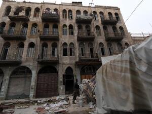 A rebel fighter monitors a street in the old city of Aleppo, Syria. (AFP/File)