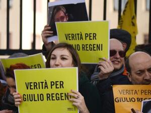 People hold placards reading 'Truth about Giulio Regeni ', an Italian student who was found dead in Egypt, bearing signs of torture. (AFP/Filippo Monteforte)