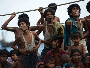 This file photo shows the desperate cries of Rohingya and Bangladeshi refugees adrift on boat as they were turned away from Thailand in September 2015. (AFP/Christophe Archambault)