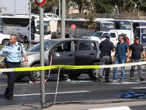 Israeli forensic policemen collect evidence from a car belonging to a victim following a shooting attack. (AFP/File)