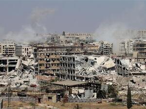 Smoke billows from buildings during battles on the northwest outskirts of Aleppo, Syria. (AFP/File)