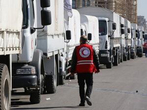 A Red Crescent convoy prepares to leave Damascus to the besieged areas of Madaya and Zabadani. (AFP/File)
