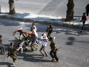 Fighters take to the streets of Aleppo. (AFP/File)