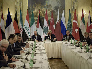 John Kerry, the US secretary of state, meets ministers from countries that are both for and against Syria's regime in Vienna. (AFP/Brendan Smialowski)