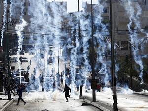 Israeli borderpolice shoot tear gas at Palestinians in the West Bank city of Bethlehem on December 18, 2015. (Twitter)