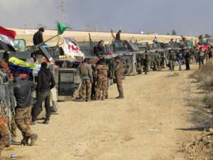 Iraqi troops congregate on a roadside approaching Ramadi. (Twitter)