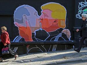 US President Donald Trump and Russian President Vladimir Putin greet each other with a kiss in this mural in the Lithuanian capital Vilnius. (AFP/File)