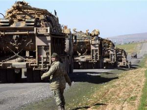 Turkish Army vehicles and tanks move near the Syrian border in rural district of Suruç. (AFP/File)