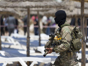 A Tunisian soldier guards the beach at the Riu Imperial Marhaba Hotel in Port el Kantaoui, on the outskirts of Sousse, in the wake of the attack which killed 38 people. (AFP/File)