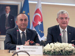 Turkish Foreign Minister Mevlut Cavusoglu (L) and Turkish EU Affairs Minister Volkan Bozkir (R) hold a press conference. (AFP/File)
