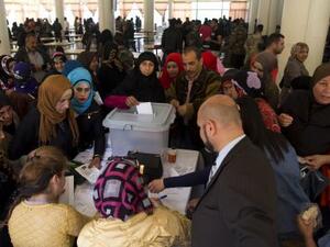 A Syrian woman casts her vote at a polling station during the Syrian parliamentary election in Damascus, Syria, Wednesday, April 13, 2016. (Twitter)