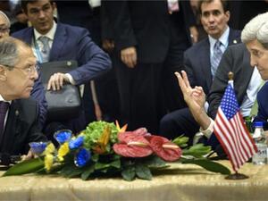 US Secretary of States John Kerry (R) gestures beside of Russian Foreign Minister Sergei Lavrov. (AFP/File)