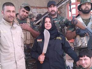 Um Hanadi and her tribal milita. (Courtesy photo)