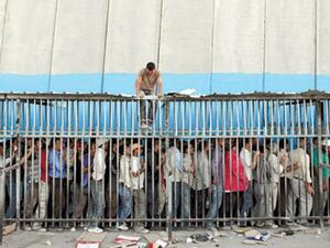 Thousands of Palestinian workers cross through checkpoints every day. (AFP/File)