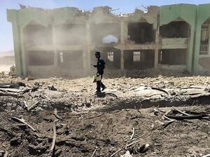 An Afghan policeman inspects the site of a suicide attack in Zabul on May 25, 2015. (AFP/File)