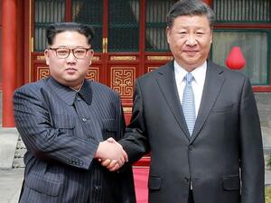 North Korean leader Kim Jong-un shakes hands with Xi Jinping in Beijing. (AFP/ File Photo)