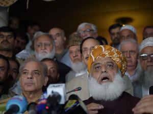 Shahbaz Sharif (R), younger brother of ousted Pakistani Prime Minister Nawaz Sharif and head of Pakistan Muslim League-Nawaz (PML-N), arrive with opposition leader Maulana Fazalur Rehman (L) for a press conference after attending an All Parties Conference in Islamabad on July 27, 2018. (AFP/Aamir Qureshi)

