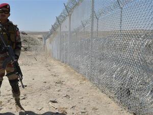 A Pakistani army soldier stands guard along the fence at the Pak-Afghan border near the Punjpai area of Quetta in Balochistan. (AFP)
