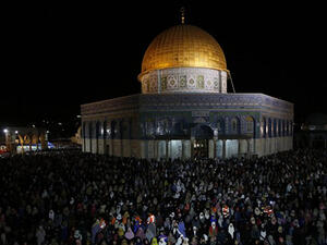 Palestinian Muslim worshippers pray overnight outside the Dome of the Rock in the Al-Aqsa mosques compound in Jerusalem's Old City on the occasion of Laylat al-Qadr. (AFP/File)