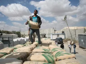 Israel restricts the entry of goods into Gaza out of fears they will be used to build tunnels, but Gazans desperately need cement for reconstruction. (AFP/Said Khatib)