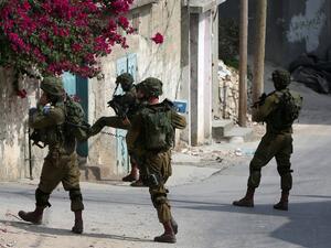 Israeli soldiers conduct searches in the northern West Bank village of Madama on August 24, 2016 after a Palestinian reportedly exited a car and stabbed an Israeli soldier on a road close to the village and to the Israeli settlement of Ariel. (AFP/Jaafar Ashtiyeh)