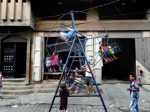 Palestinian children play on a street in the center of Gaza City on June 29, 2016. (AFP/Thomas Coex)