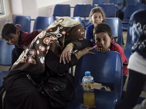 Palestinians residing in the Gaza Strip wait for travel permits to cross into Egypt through the Rafah border crossing in the southern Palestinian coastal enclave after it was open for five days by Egyptian authorities, on June 29, 2016. (AFP/Said Khatib)