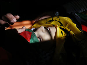 The body of Mahmud Hattab, 16, at his funeral in al-Jalazun refugee camp, March 24 2017. (AFP/Abbas Momani)