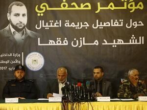 Tawfiq Abu Naim (2nd L), head of Hamas-run security forces in Gaza, speaks during a press conference on the killing of senior Hamas official Mazen Faqha, in Gaza City, on May 16, 2017. (Mohammed Abed/AFP)