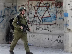 An Israeli soldier on patrol in the southern West Bank city of Hebron. (AFP/File)