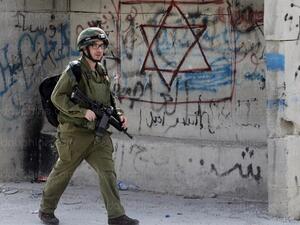 An Israeli soldier on patrol in the southern West Bank city of Hebron. (AFP/File)