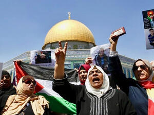 Families of Palestinians imprisoned in Israeli jails demonstrate outside Dome of the Rock at Al-Aqsa mosque compound in Jerusalem's Old City (AFP)