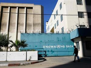 A Palestinian man walks past the building of the UNRWA headquarters in Gaza City on January 8, 2018. (AFP/ File Photo)