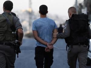 Israeli security forces arrest a Palestinian youth in East Jerusalem. (AFP)