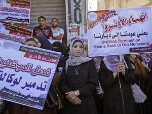 Palestinian employees of United Nations Relief and Works Agency (UNRWA) take part in a protest against job cuts by UNRWA, in Gaza City. (AFP/ SAID KHATIB)