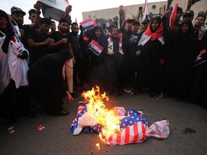 Iraqi protestors burn a US flag during a demonstration in Baghdad on April 15, 2018, opposing the joint Western air strikes against Syria's regime. The United States, Britain and France took military action in response to an alleged chemical attack in the rebel-held town of Douma a week ago that killed at least 40 people. Iraq warned that Western air strikes on Syria is a "very dangerous" development that could fuel a jihadist resurgence in the region
Ahmad al-Rubaye / AFP