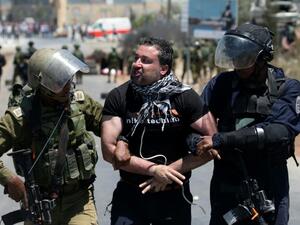 Israeli army detains Palestinian during clashes. (AFP/ File Photo)