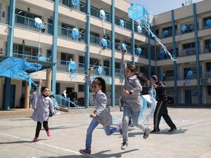 Girls support the Dignity Is Priceless campaign at an Unrwa school in Gaza City. (AFP/File Photo)