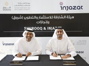 Partnership agreement being signed between  Injazat CEO, Khaled Al Melhi, left, and Shurooq’s Executive Chairman H.E. Marwan bin Jassim Al Sarkal