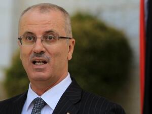 Palestinian Authority Prime Minister Hamdallah speaks during a press conference following the first cabinet meeting of the new Palestinian unity government in the West Bank city of Ramallah. (AFP/ File Photo)