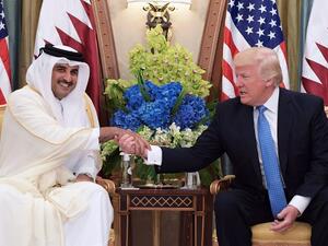 This file photo taken on May 21, 2017 shows US President Donald Trump (R) shaking hands with Qatar's Emir Sheikh Tamim Bin Hamad Al-Thani, during a bilateral meeting at a hotel in the Saudi capital Riyadh. (Mandel Ngan/AFP)
