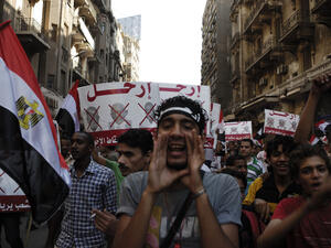 Unidentified anti-Muslim Brotherhood protester in Tahrir Square shout slogans calling for Mohammad Morsi's resignation on June 30, 2013 in Cairo, Egypt (Shutterstock/File Photo)