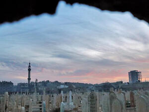 A general view shows a cemetery in the rebel-held town of Douma. The city, on the outskirts of the capital Damascus, is surrounded and regularly shelled by regime forces. (AFP/File)