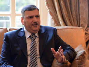 Riyad Hajab, the Syrian opposition coordinator, speaking at a meeting in Cairo in 2013. (AFP/File)