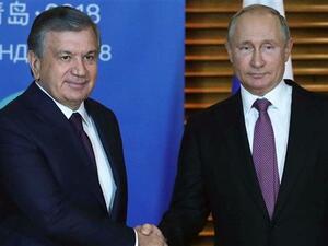 Russian President Vladimir Putin (R) meeting with Uzbek President Shavkat Mirziyoyev on the sidelines of the Shanghai Cooperation Organization (SCO) Summit in Qingdao. (AFP/File)
