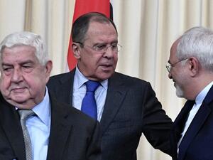 Russian Foreign Minister Sergei Lavrov (C), his Iranian counterpart Mohammad Javad Zarif (R) and Syrian Foreign Minister Walid Muallem (L) leave a hall after a joint press conference after their talks in Moscow on April 14, 2017. (AFP/Alexander Nemenov)